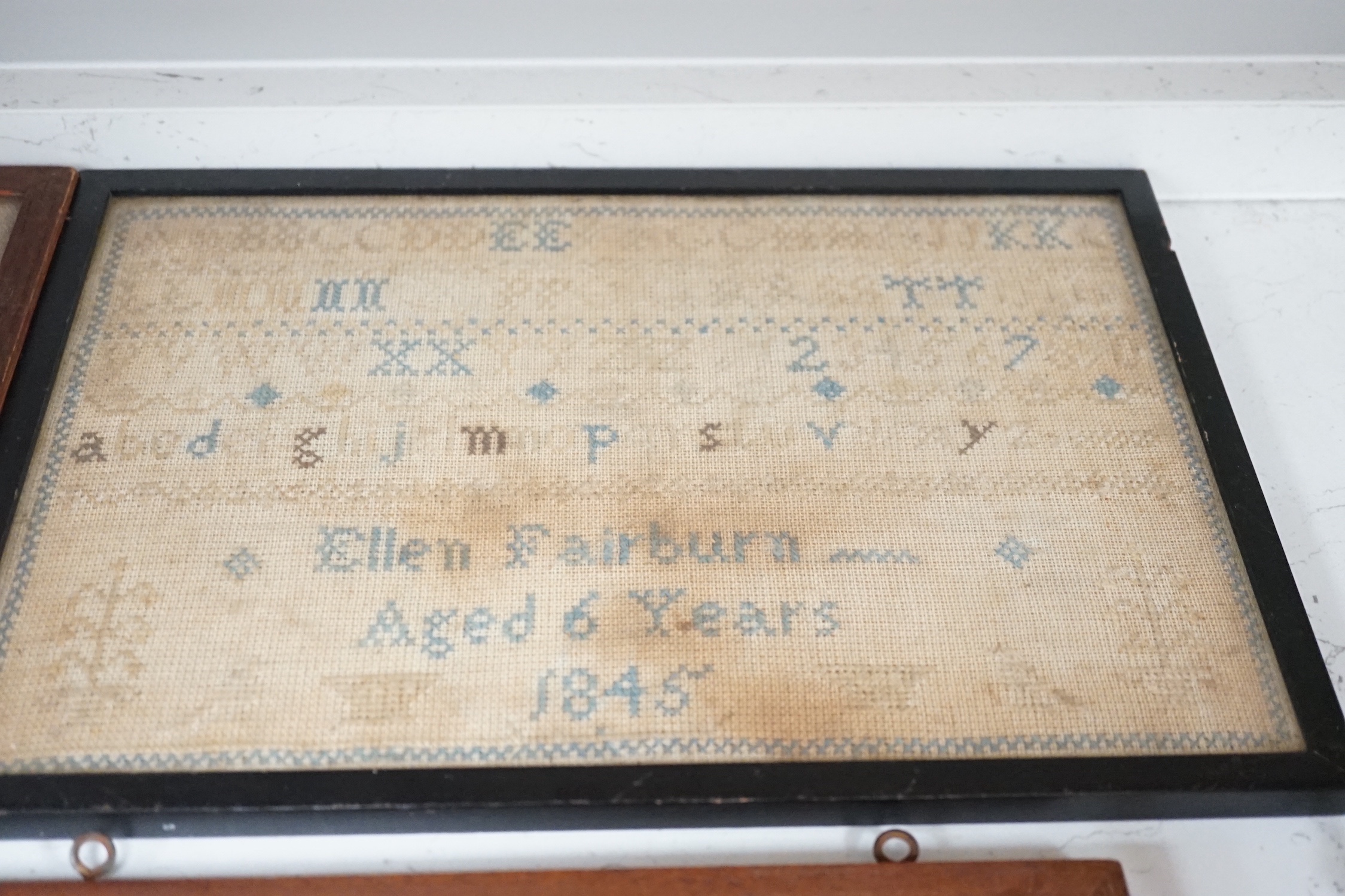 An unusual William IV ‘Register of birth’ small sampler together with four other samplers ranging in date from 1778 to 1851, largest 56 cm x 20.5 cm (5)